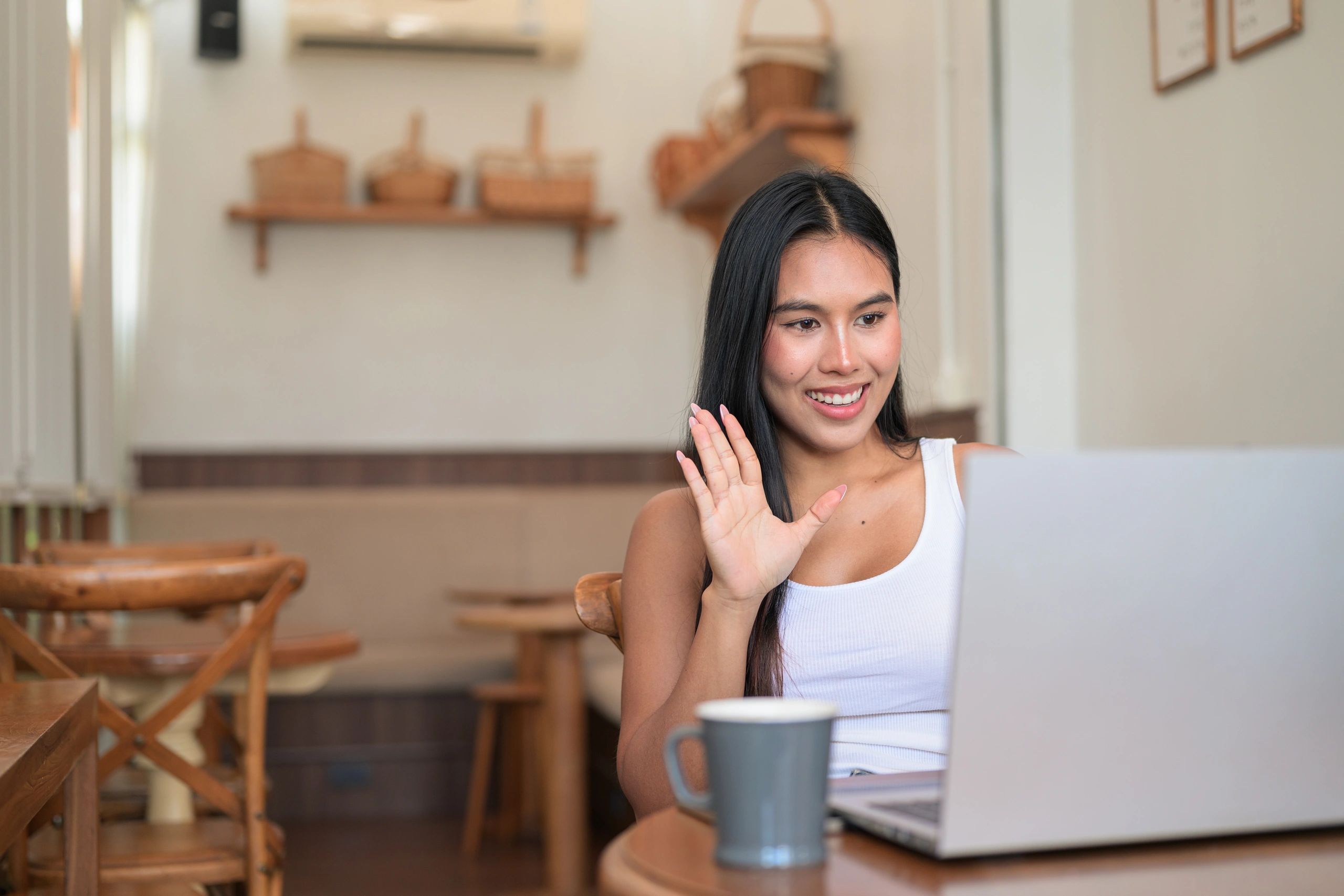 Learner connecting with a tutor online from a laptop
